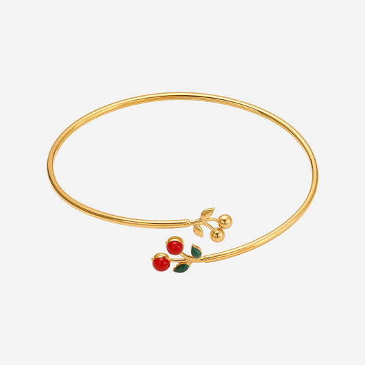 Brazalete de acero inoxidable con cereza roja y incrustaciones de circonitas.