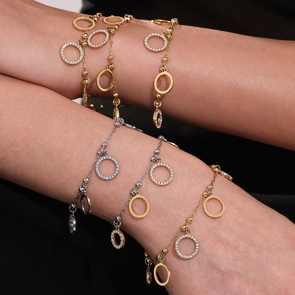 Pulsera de circonitas redondas de acero inoxidable bañada en oro de 18 quilates