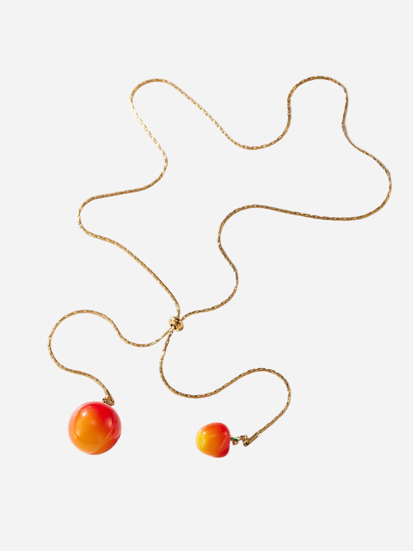 Necklace with two colorful beads on a white background