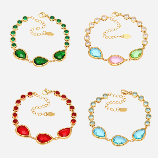 Multicolor sea glass bracelet set with teardrop stones in green, red, blue and pink, gold stainless steel, glossy close-up on white