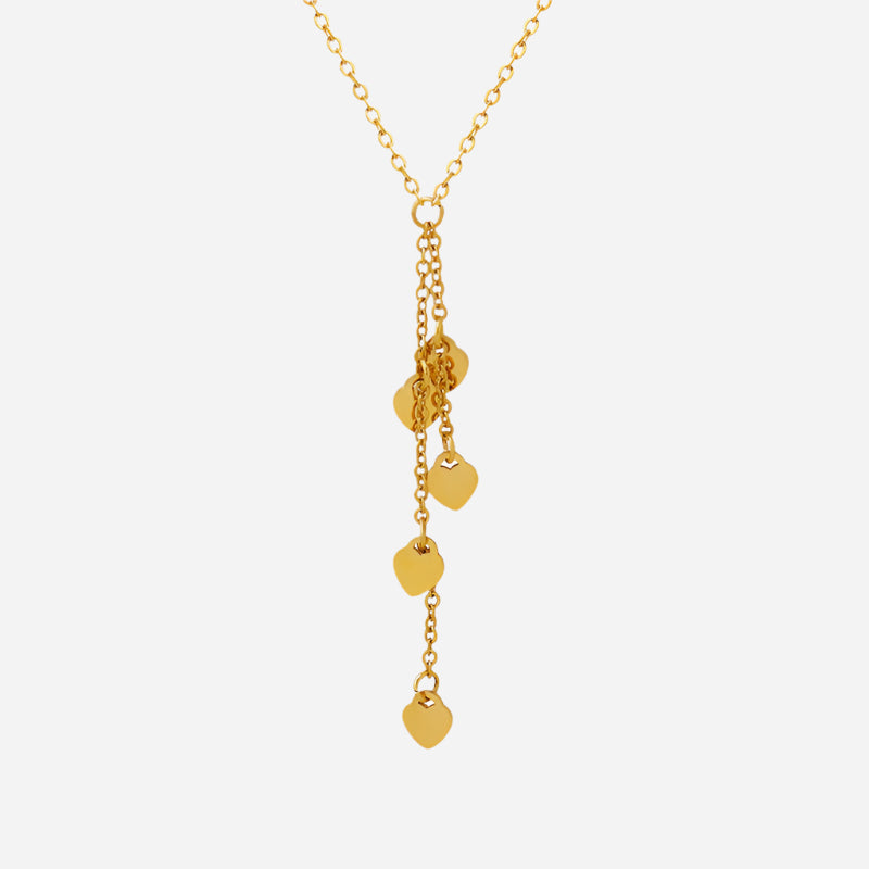 Gold necklace with heart-shaped pendants on a white background
