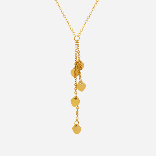 Gold necklace with heart-shaped pendants on a white background