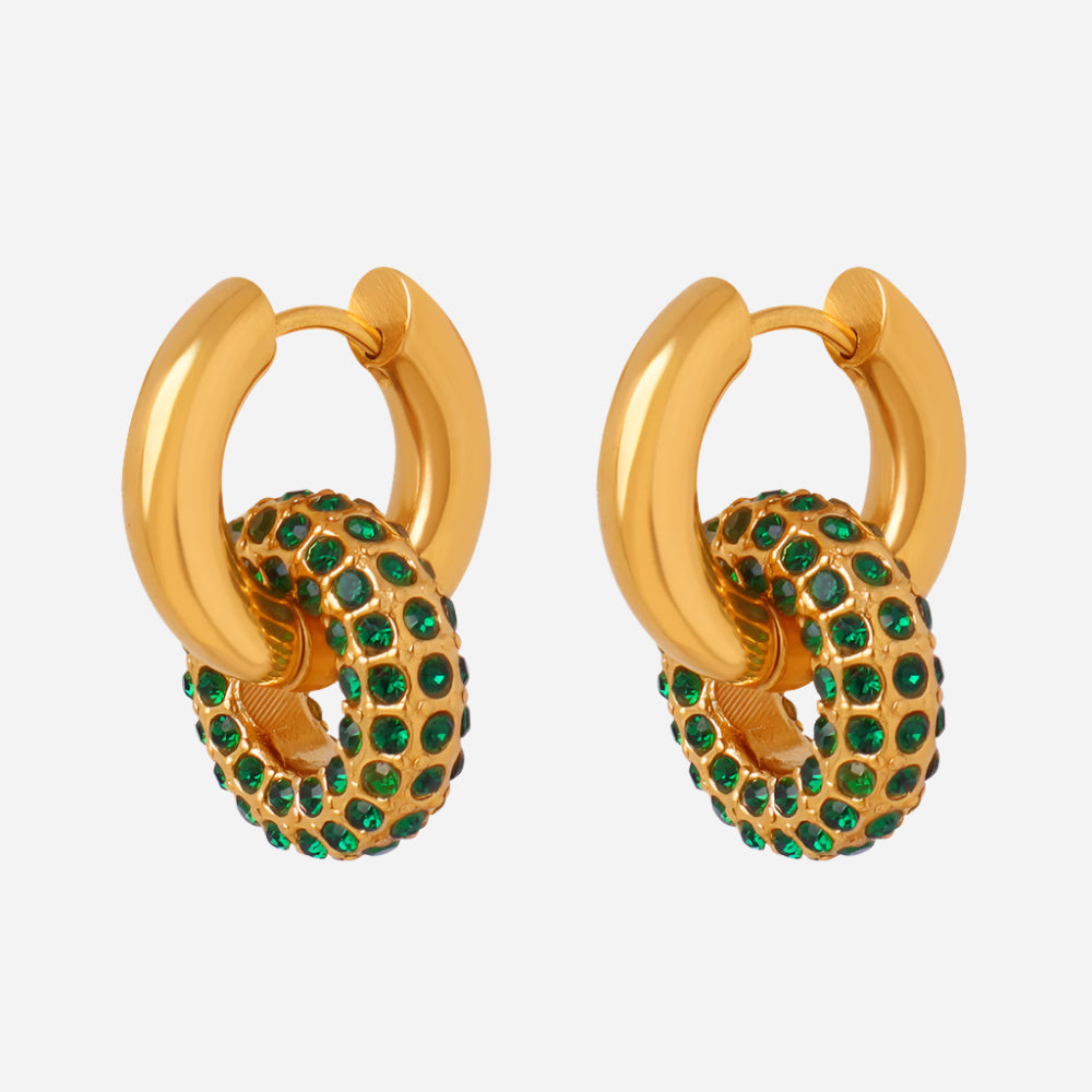 Gold hoop earrings with green gemstones on a light gray background
