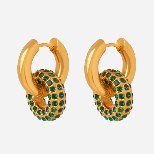 Gold hoop earrings with green gemstones on a light gray background