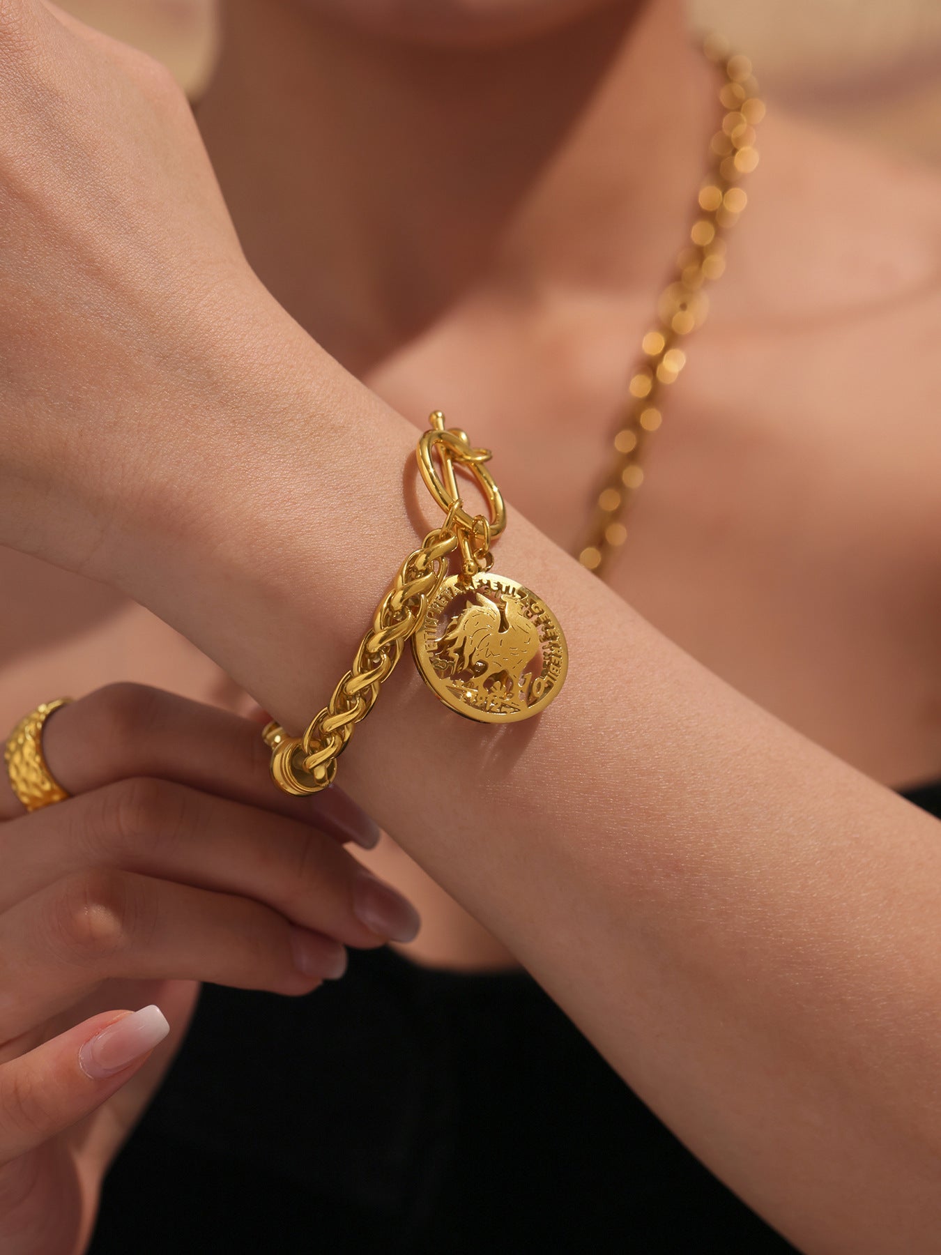  Woman wearing 18K gold curb chain tennis bracelet with urban outfit