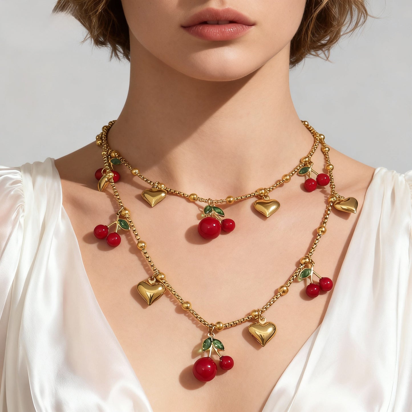 Collares con dije de cereza y circón