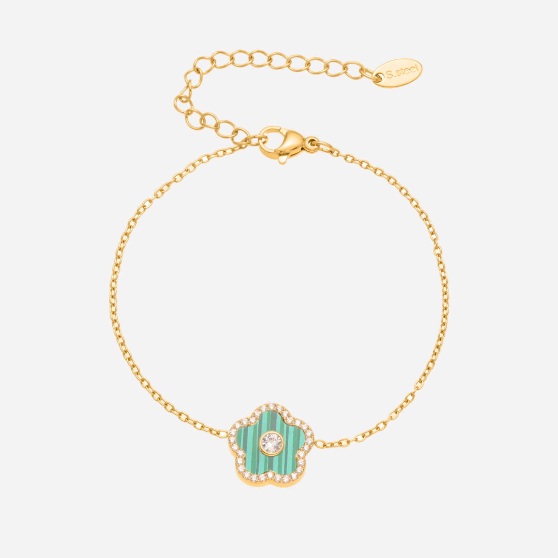 Gold bracelet with a turquoise charm on a white background