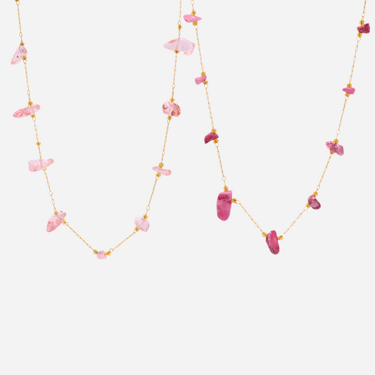 Pink and rose natural stone tennis necklaces on white background